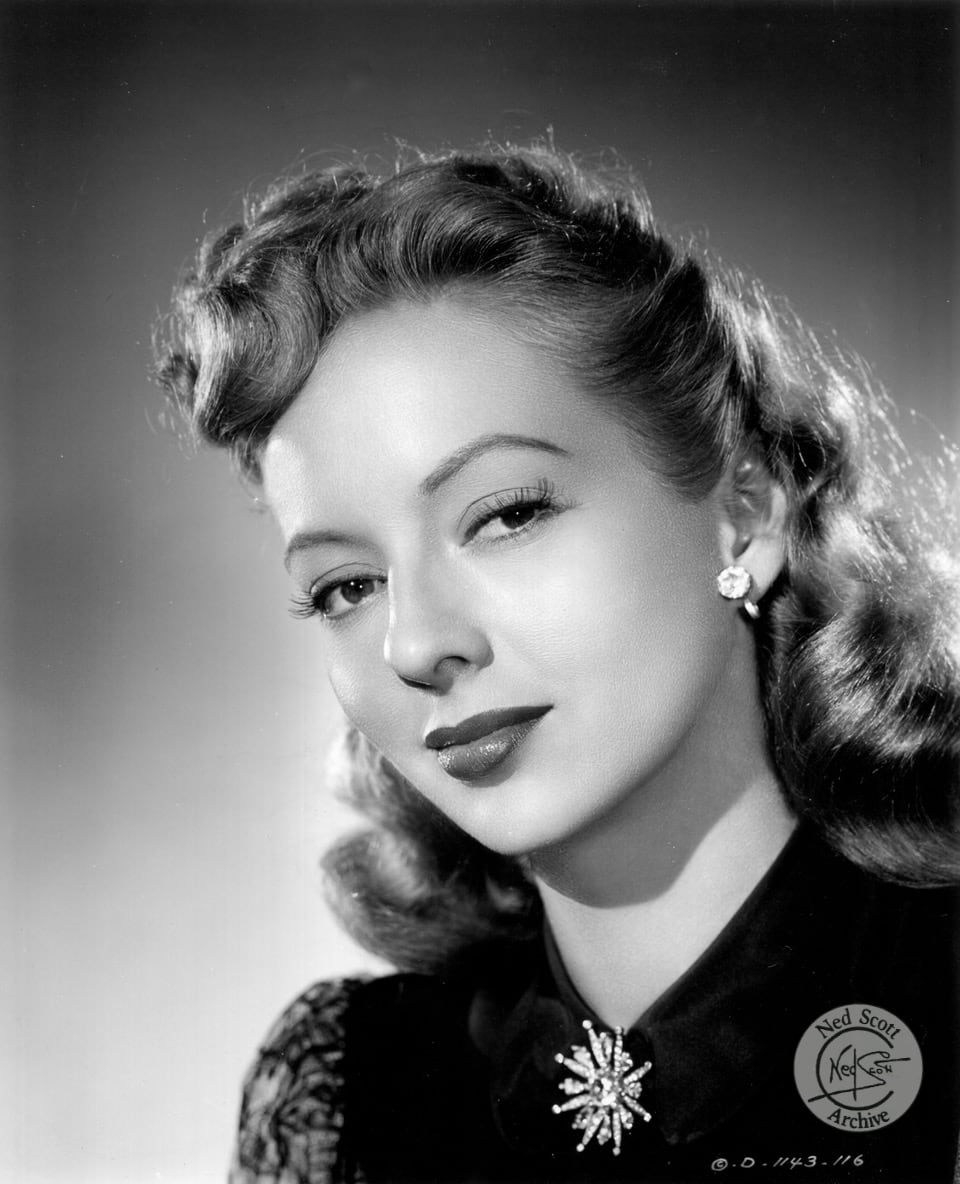Henry Levin directs this romantic comedy, 'The Mating of Millie' 1948, starring Evelyn Keyes as the protagonist.  Ned Scott captures Ms. Keyes with an enticing expression. Her role is supported by Glenn Ford.  Millie wants desperately to adopt her orphaned neighbor, Tommy, but Millie finds she needs to present a husband for an interview.  Things get crazy from there as a playboy neighbor becomes involved in the hoax.
